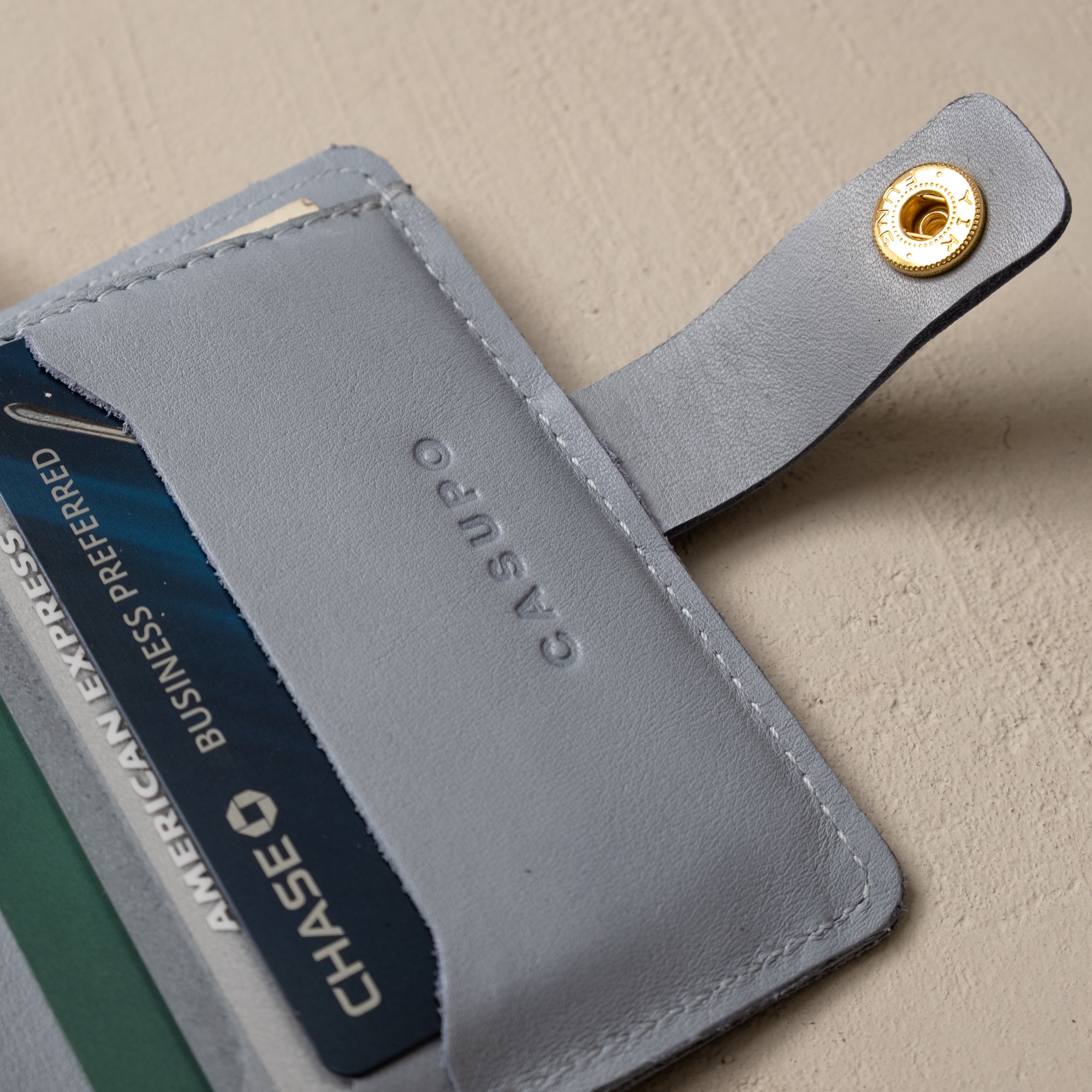 CASUPO ice blue snap wallet displaying card slot capacity