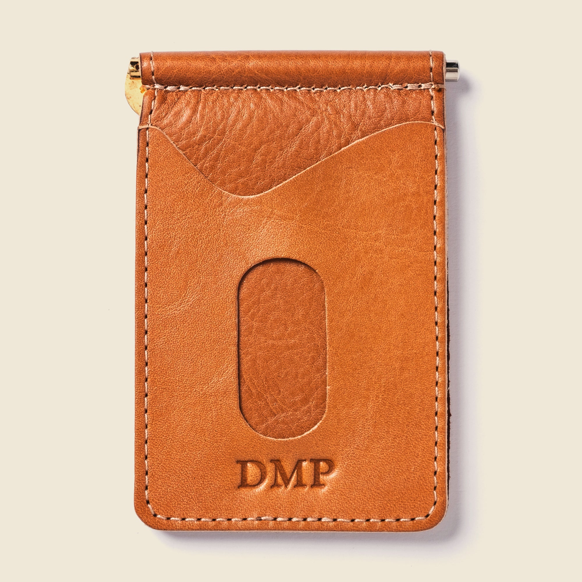 Tan leather wallet with initials embossed for a gift