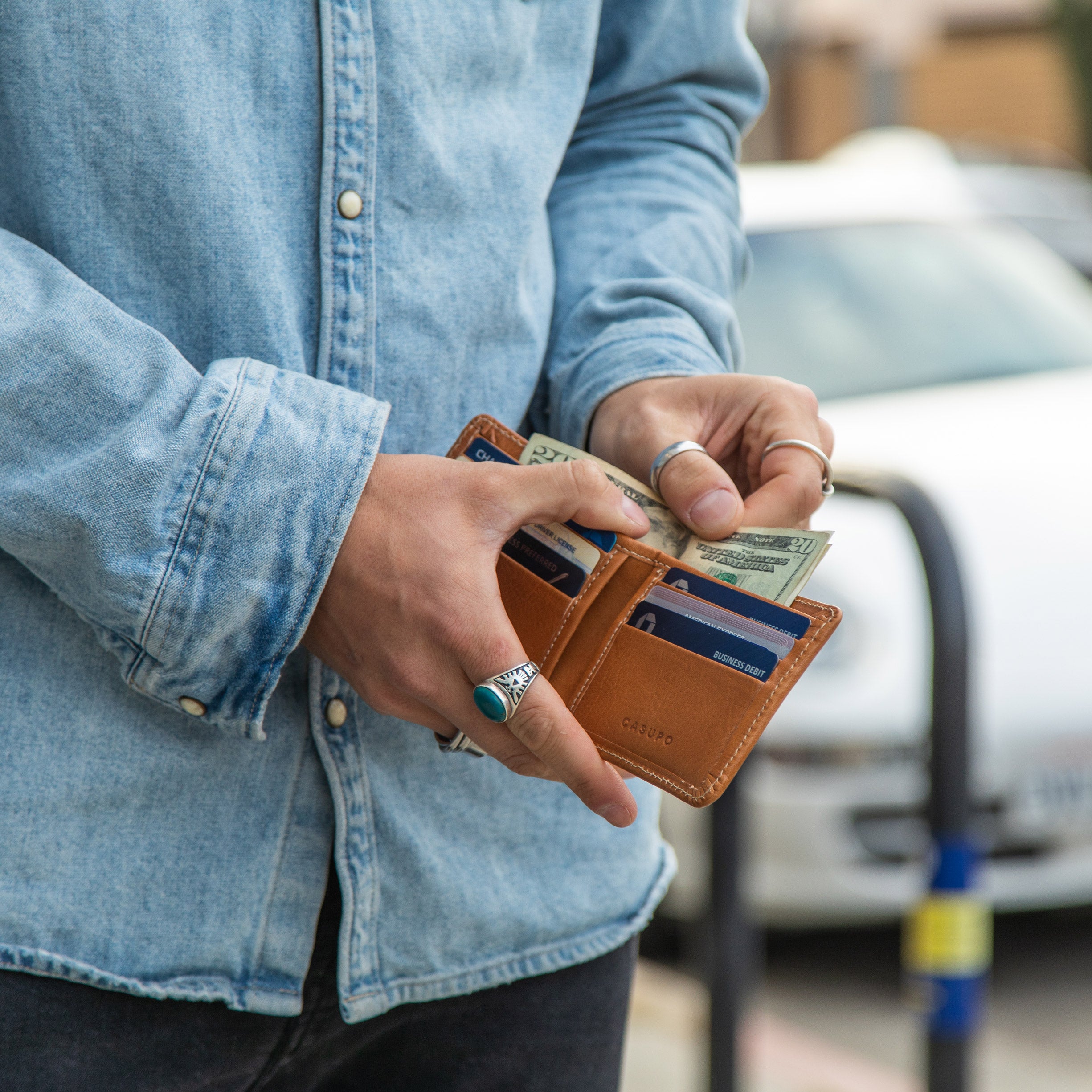 Hands holding a Chocolate Large Billfold Wallet with RFID protection - Casupo
