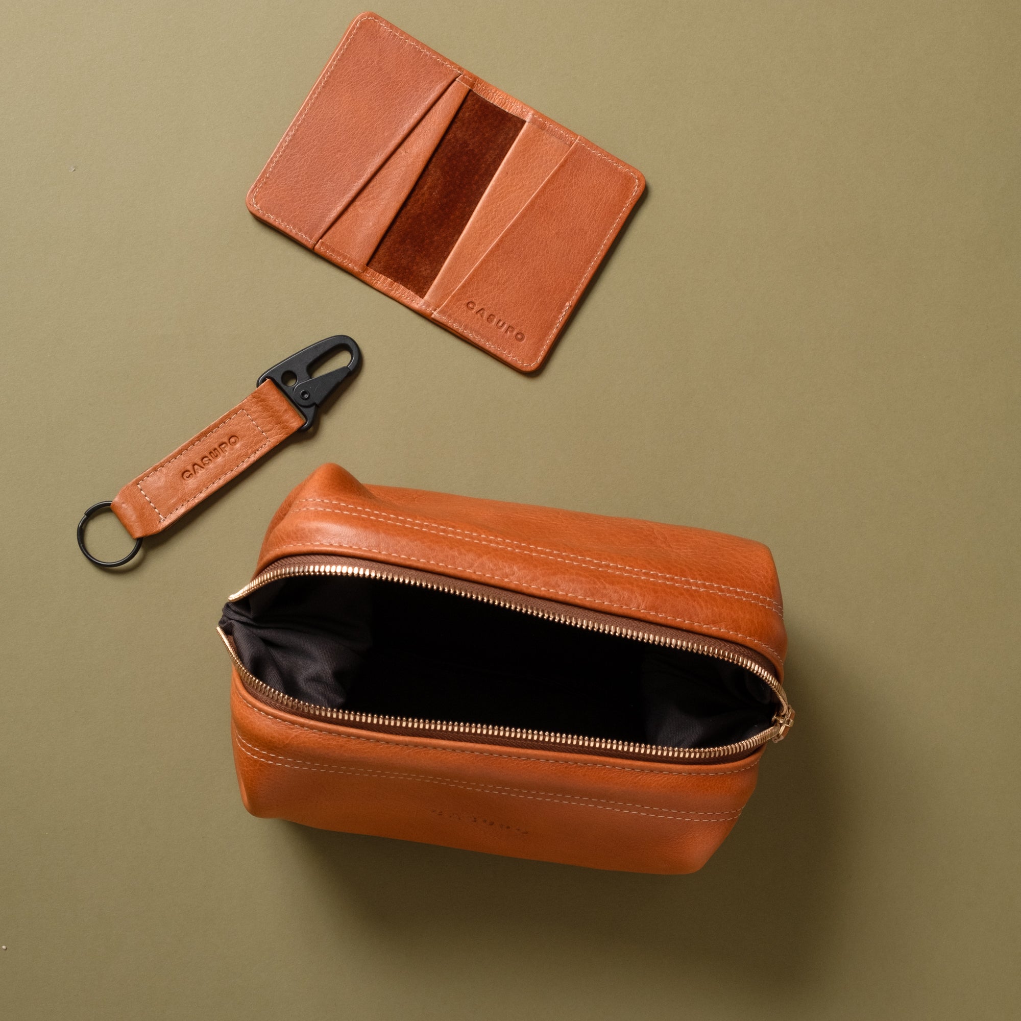 tan brown toiletry bag, bifold wallet and keychain for gifting