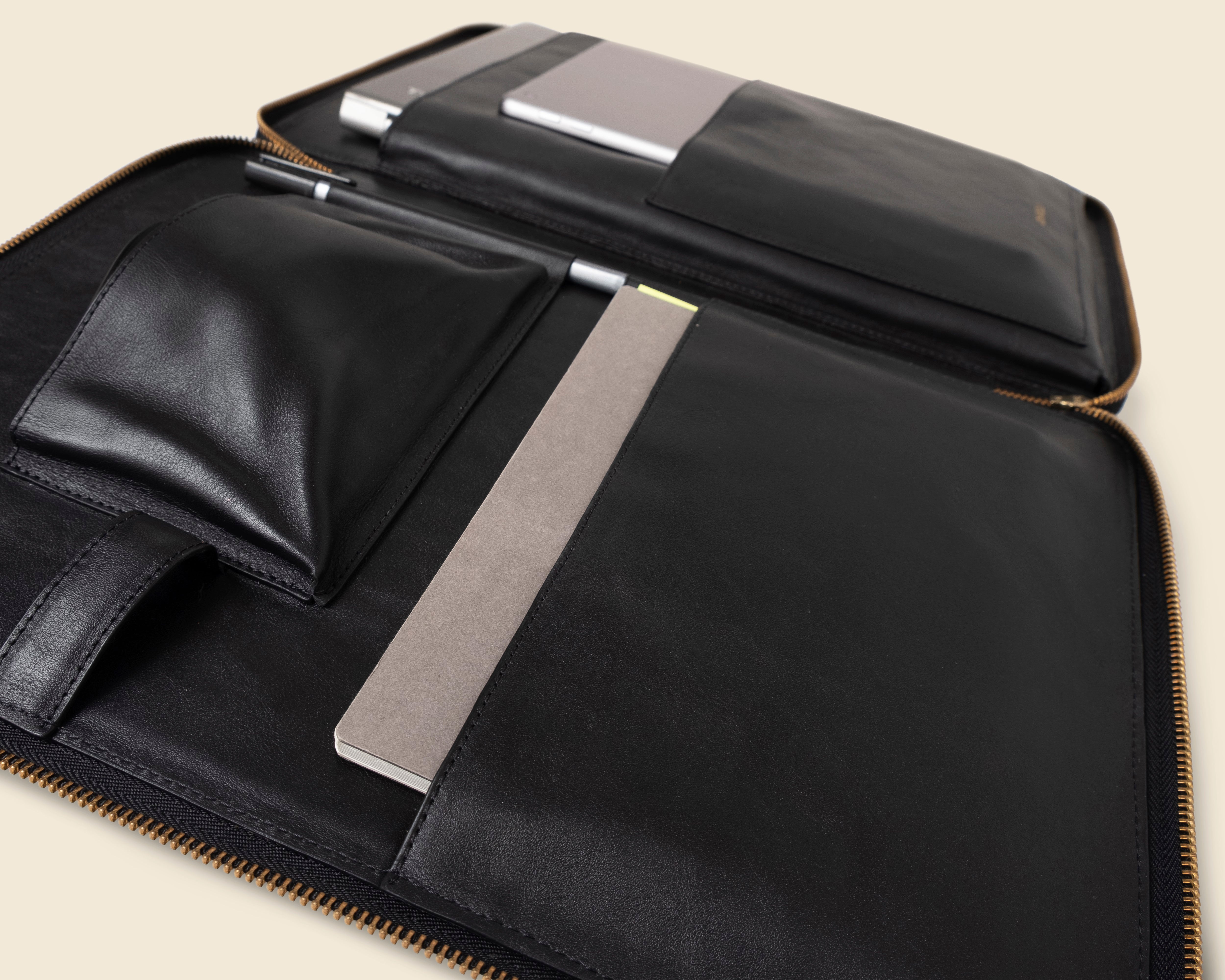 black leather zippered laptop pad folio