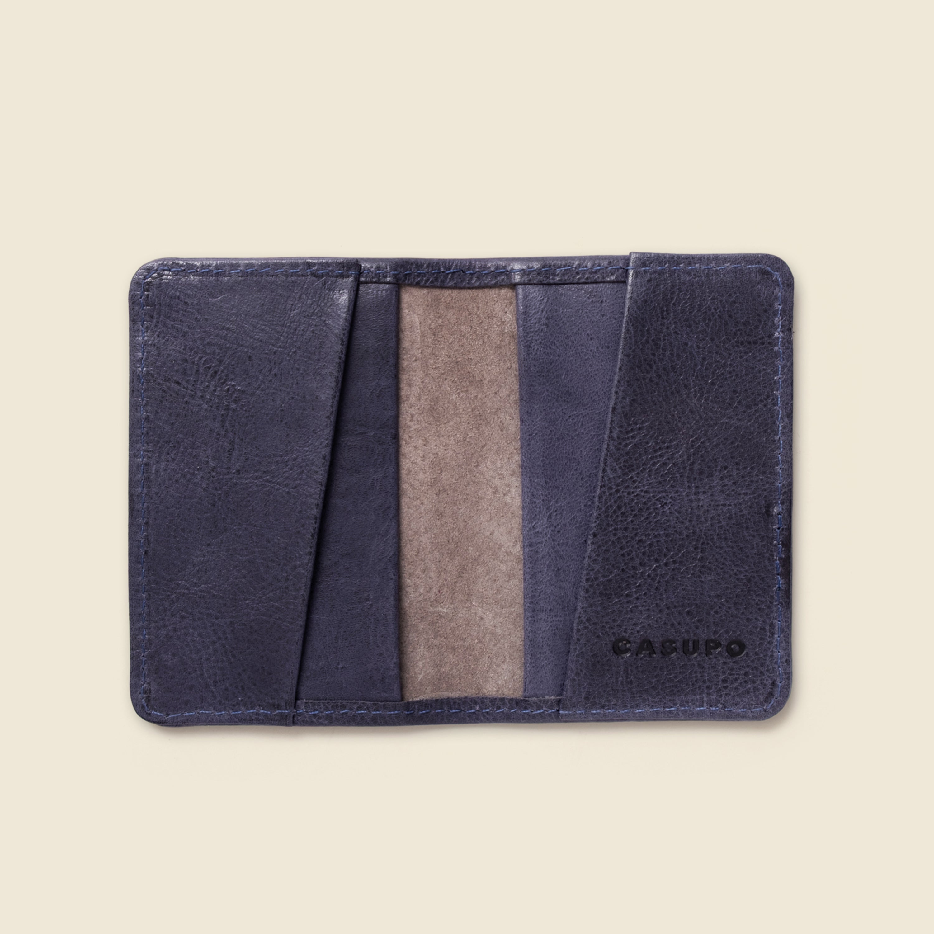 Indigo wallet with beige accent on a white background