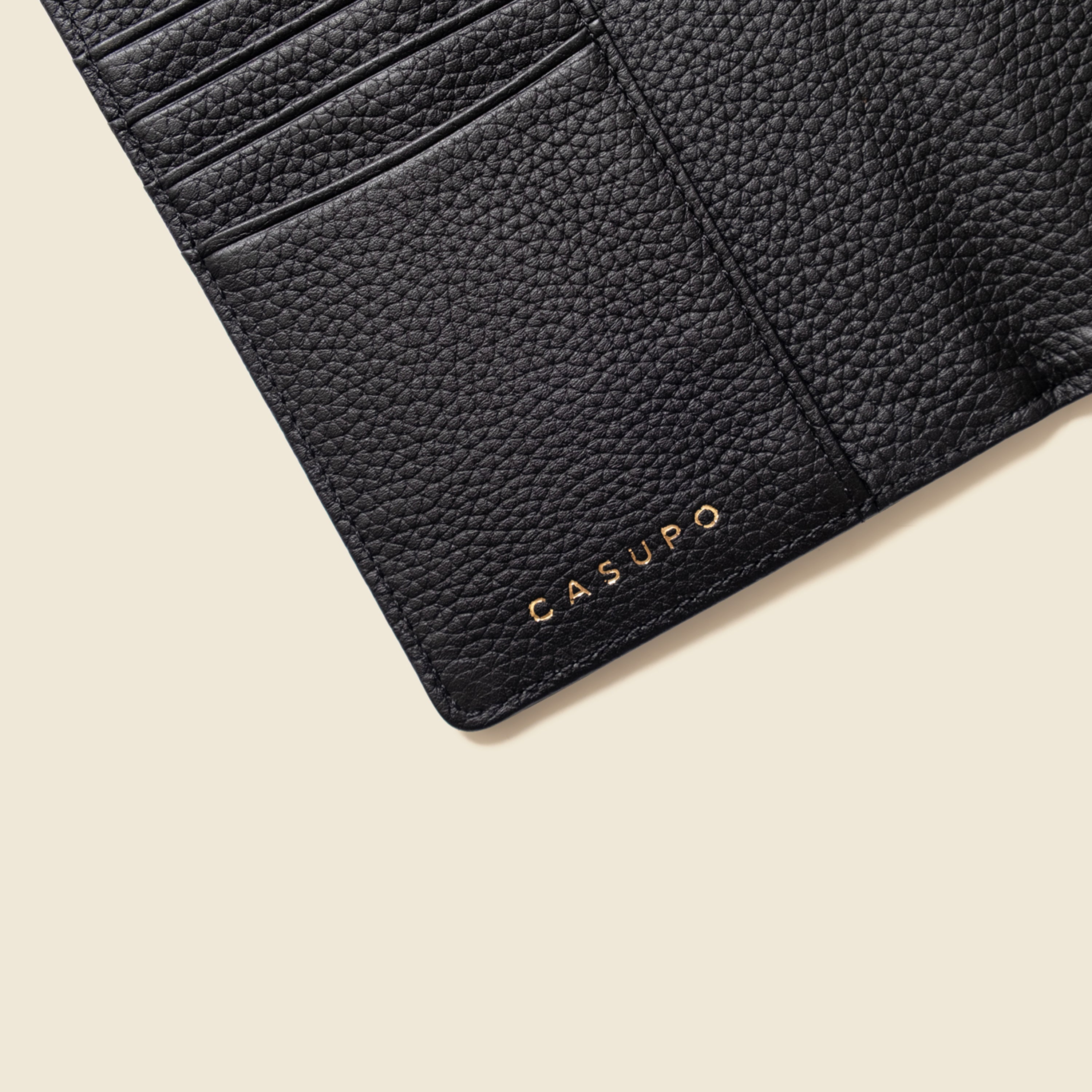 Black leather wallet with 'Casulo' branding on a white background