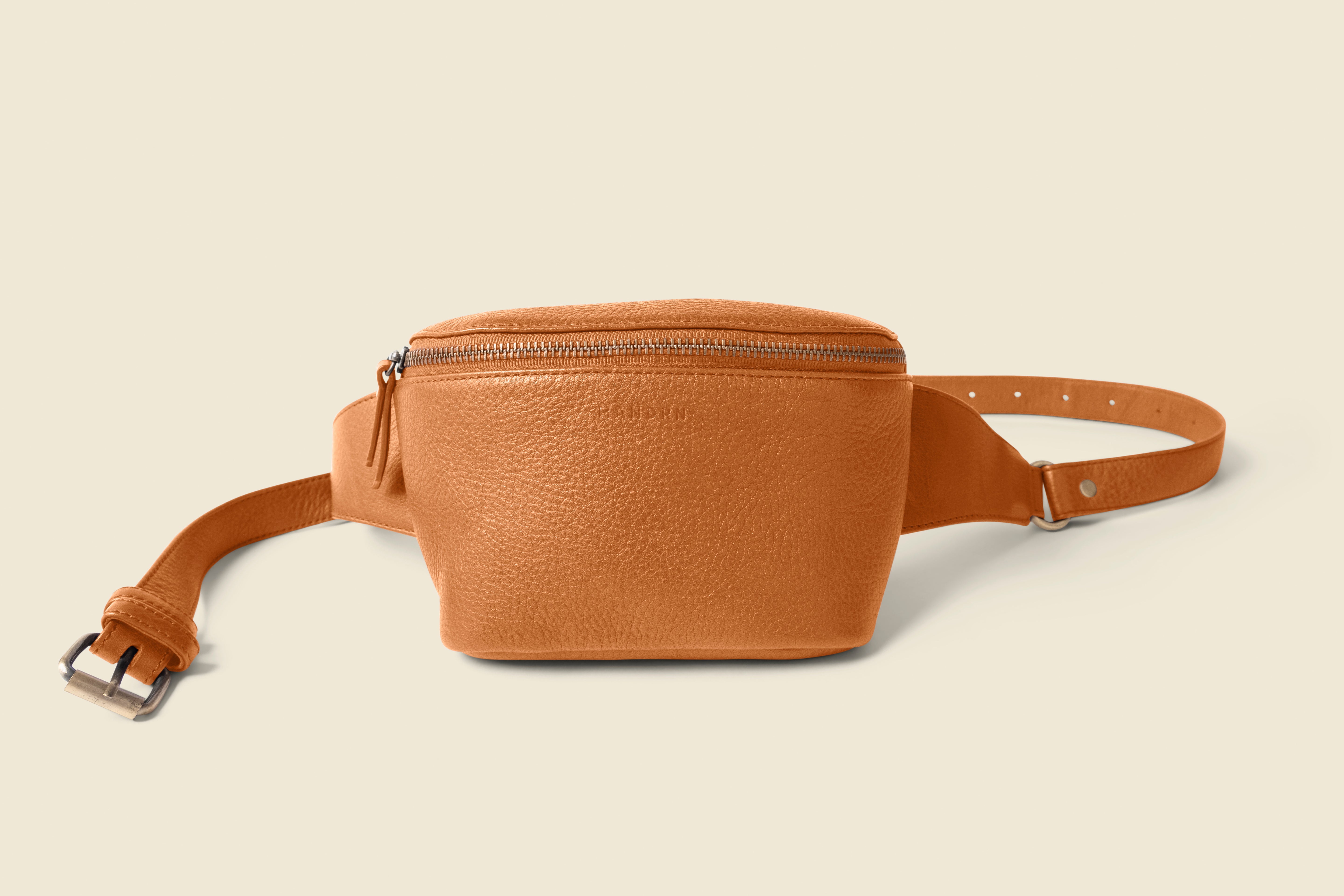 tan leather fanny pack bag for private events and corporate gifts.