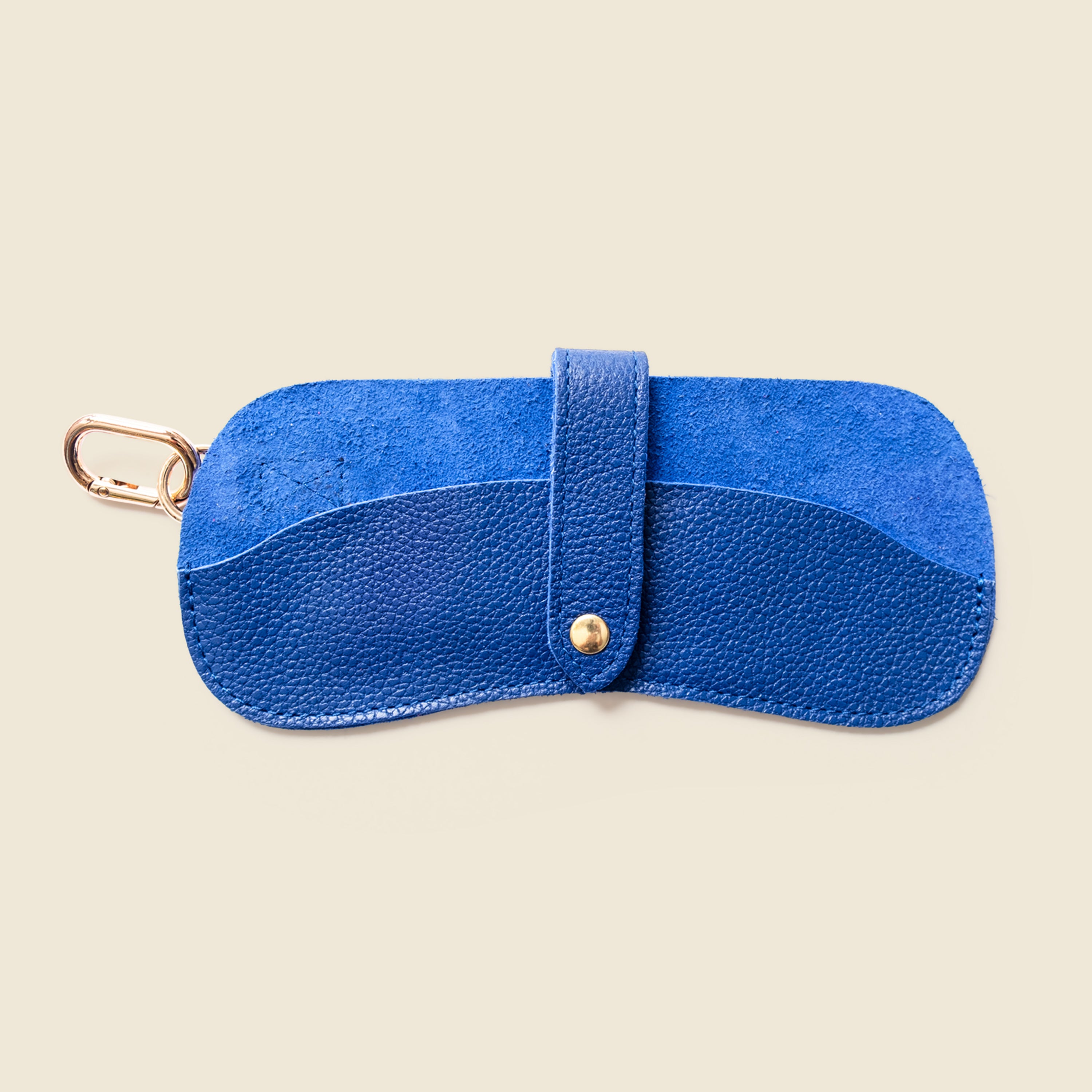 Blue leather sunglasses case with a strap on a white background