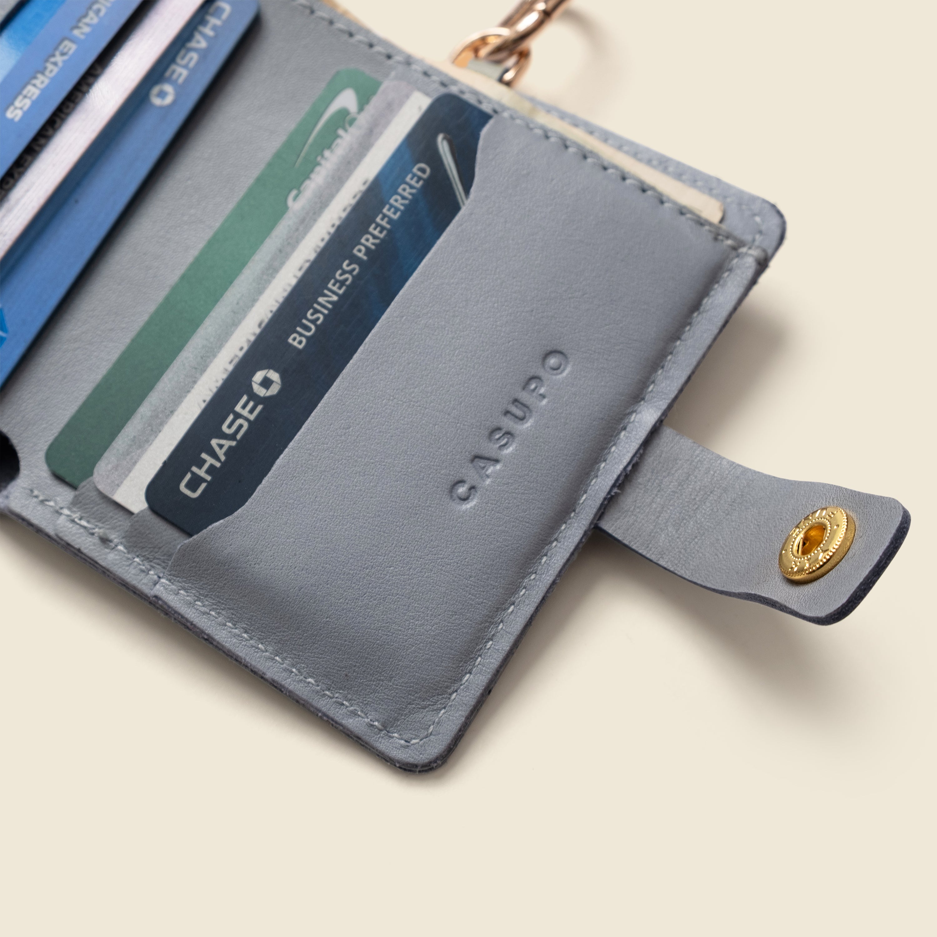Ice blue CASUPO snap wallet open showing card slots and interior