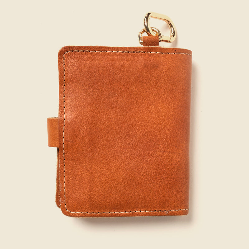 Brown leather wallet with gold ring for keys or strap