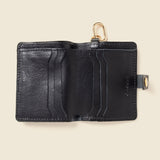 Black leather wallet with gold ring for keys or strap, open with 6 card pockets and 1 long cash pocket. 