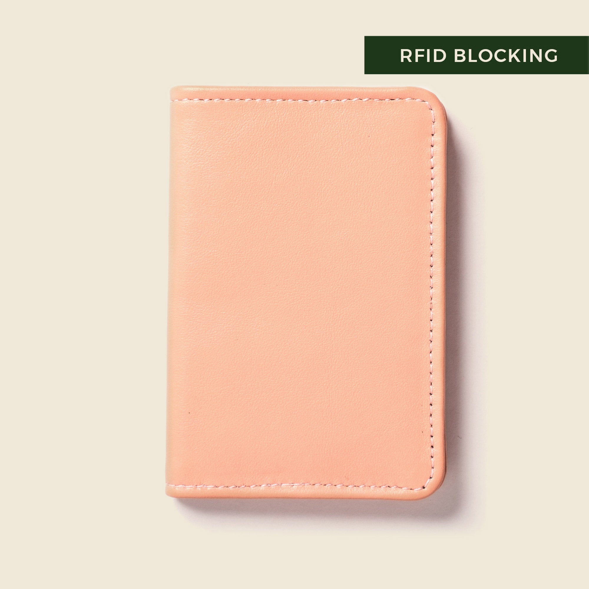 Light pink leather bifold wallet for cards and cash for women