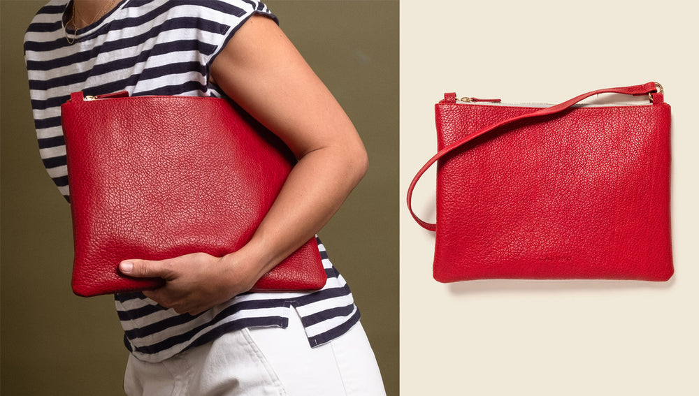 Red Leather crossbody bag, woman holding a red leather bag the size of an ipad