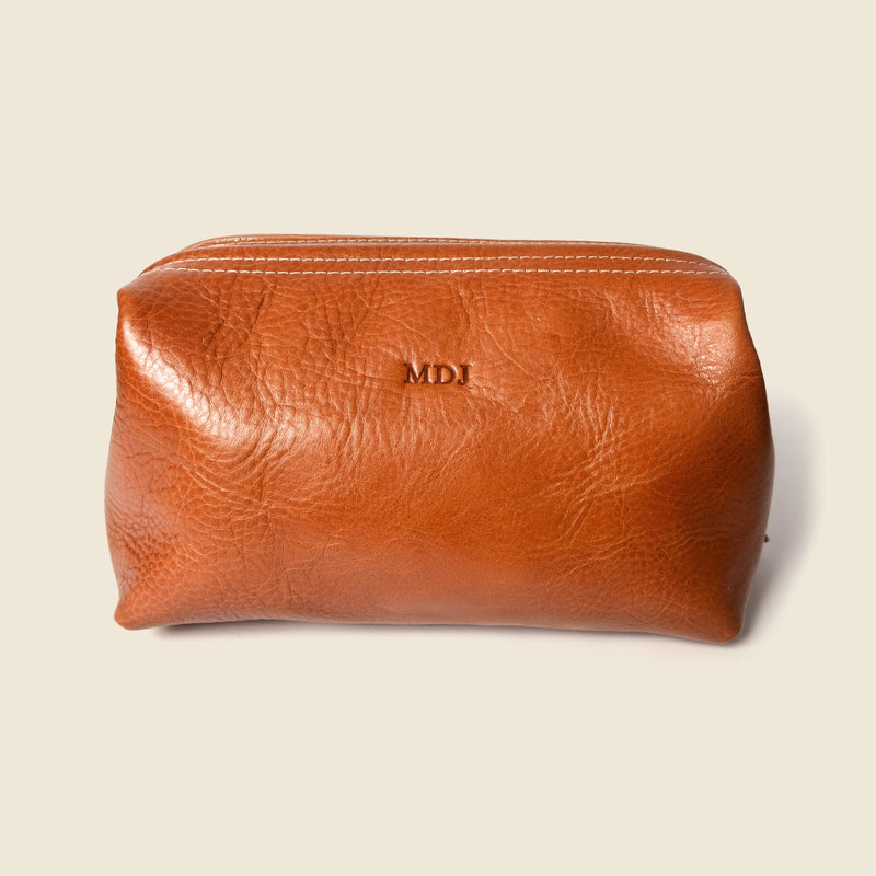 Leather toiletry bag with monogrammed initials
