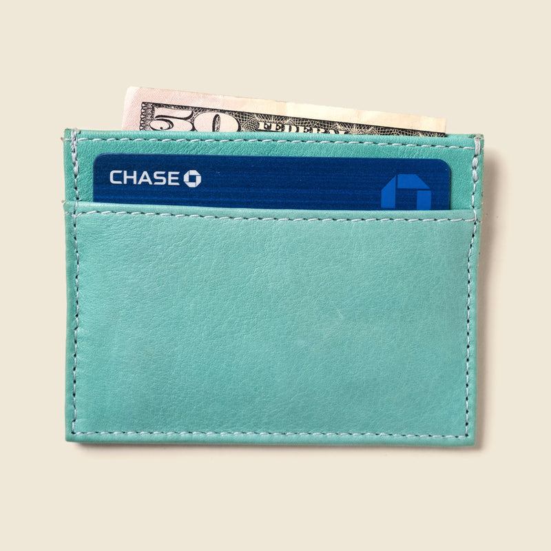Pastel blue leather cardholder for women. Small and thin leather wallet with 4 pockets